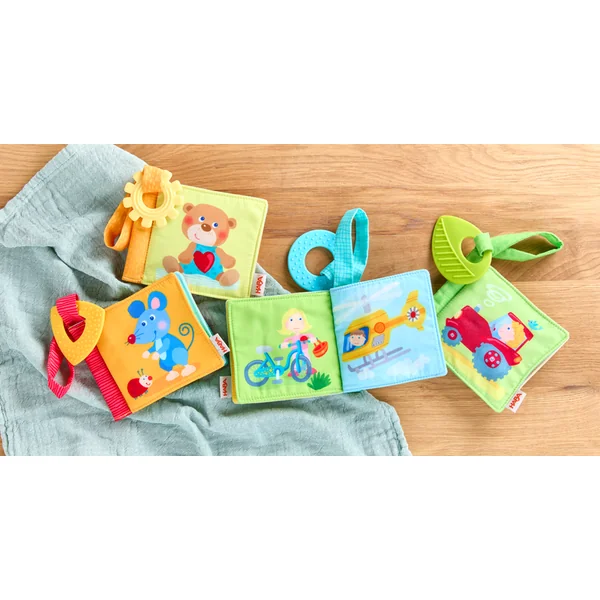 Haba Livre en tissu pour poussette avec anneau de dentition Premiers mots